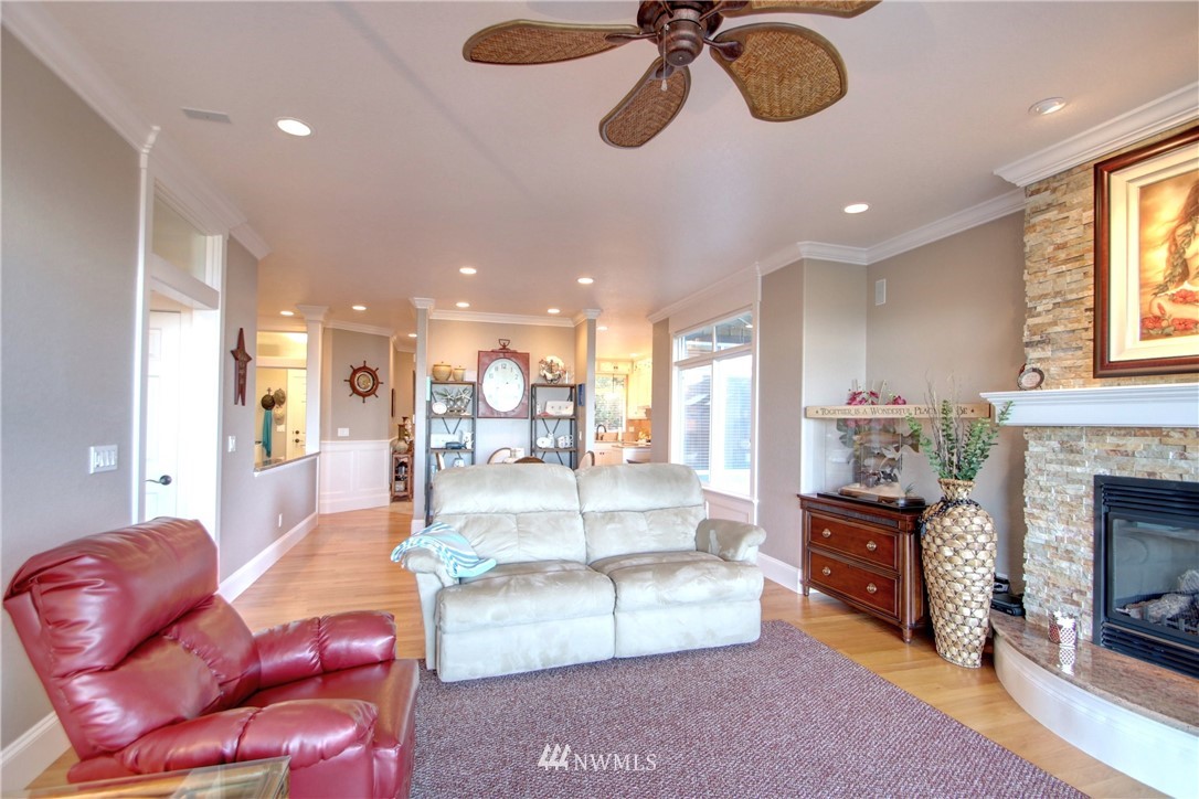 3907 Ridgetop Anacortes, WA 98221 - Photo 8 of 23 a living room with furniture fireplace and window
