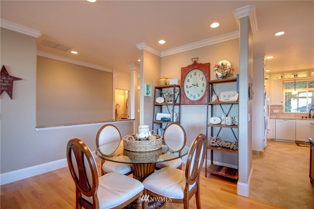 3907 Ridgetop Anacortes, WA 98221 - Photo 10 of 23 a view of a dining room with furniture and wooden floor