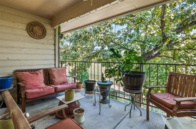 a outdoor living space with furniture and a flat screen tv