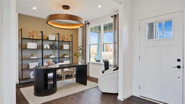 a room with wooden floor and furniture