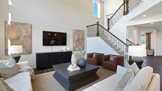 a living room with furniture fireplace and a flat screen tv
