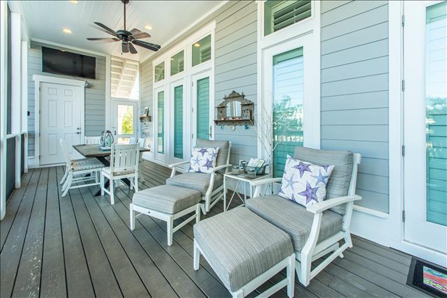 9 West Chester St Inlet Beach Inlet Beach, FL 32461 - Photo 14 of 54 a outdoor space with patio the couches and a dining table with wooden floor