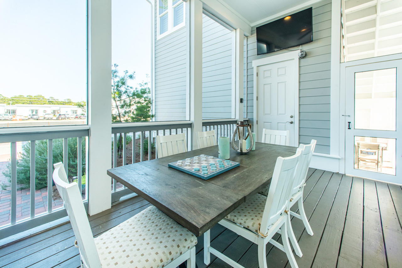 9 West Chester St Inlet Beach Inlet Beach, FL 32461 - Photo 15 of 54 a view of a dining room with furniture window and wooden floor