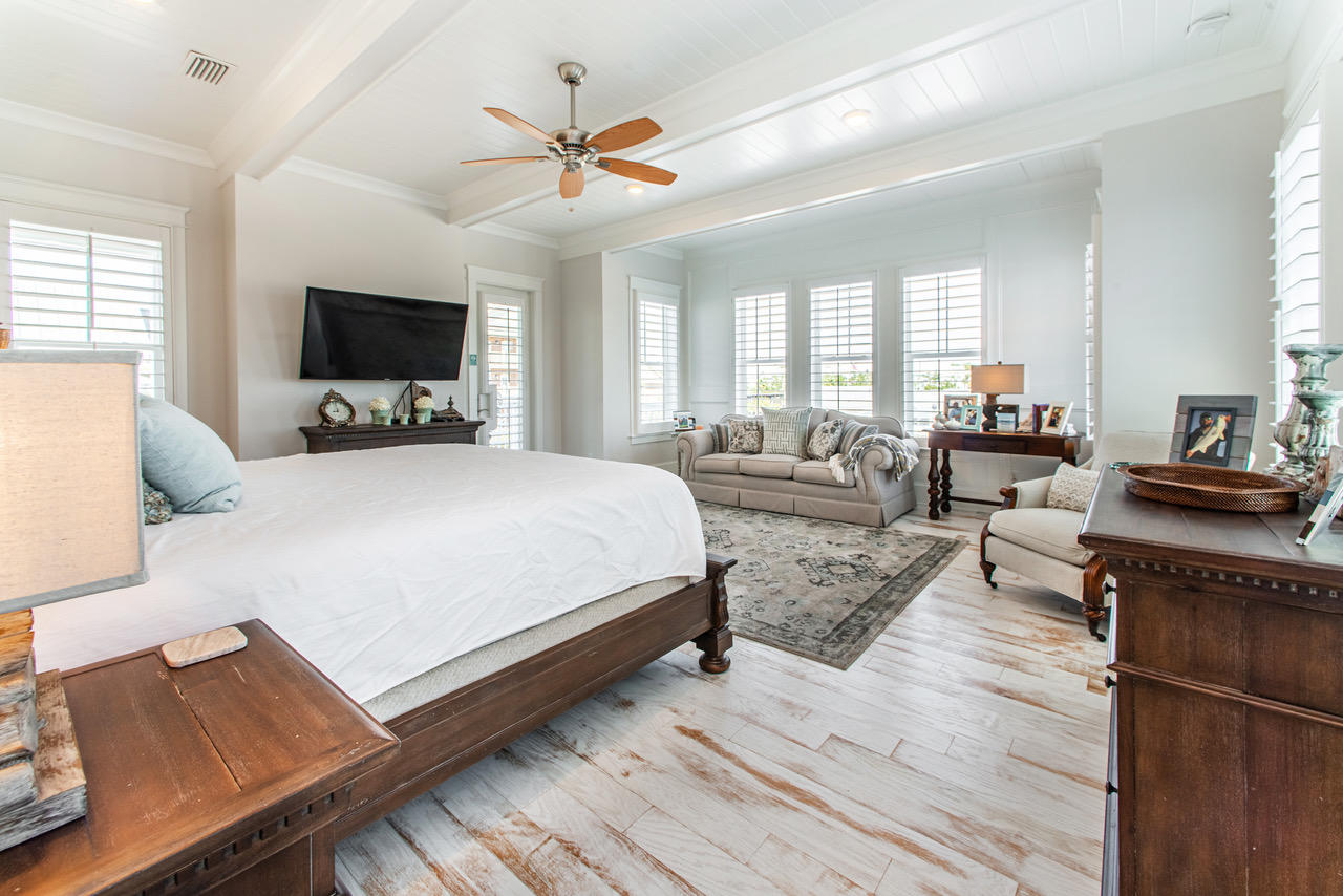9 West Chester St Inlet Beach Inlet Beach, FL 32461 - Photo 18 of 54 a bedroom with a bed a couch and a flat screen tv