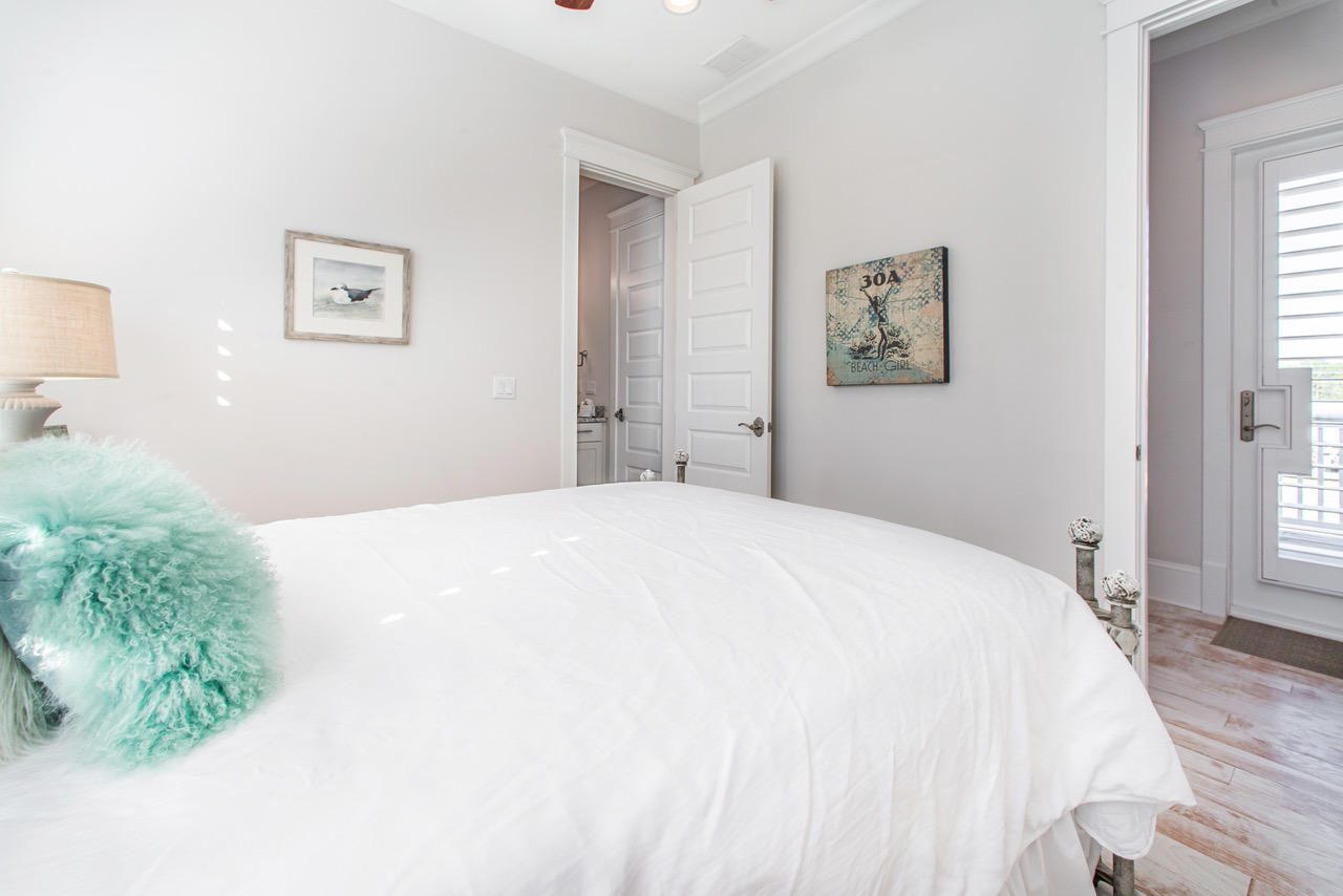 9 West Chester St Inlet Beach Inlet Beach, FL 32461 - Photo 26 of 54 a bedroom with a bed and a large mirror