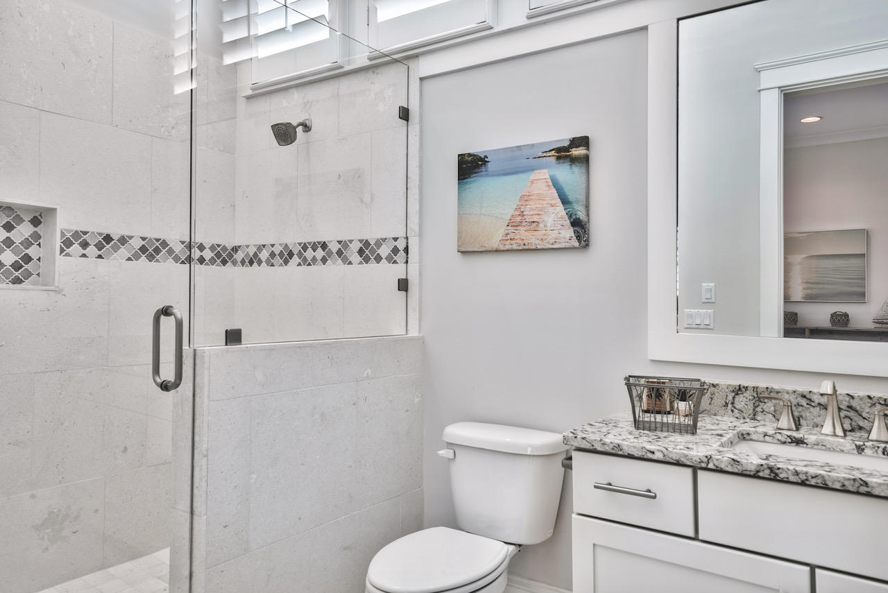 9 West Chester St Inlet Beach Inlet Beach, FL 32461 - Photo 30 of 54 a bathroom with a granite countertop toilet sink and mirror