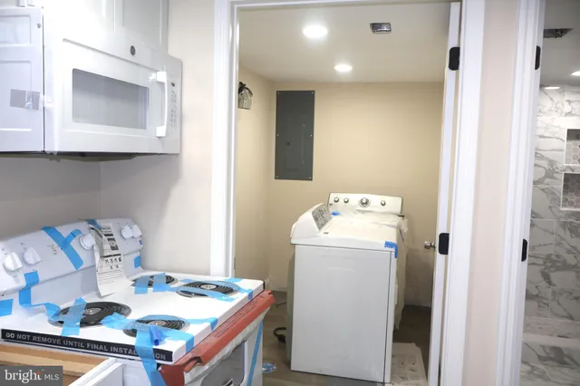 a utility room with dryer and washer