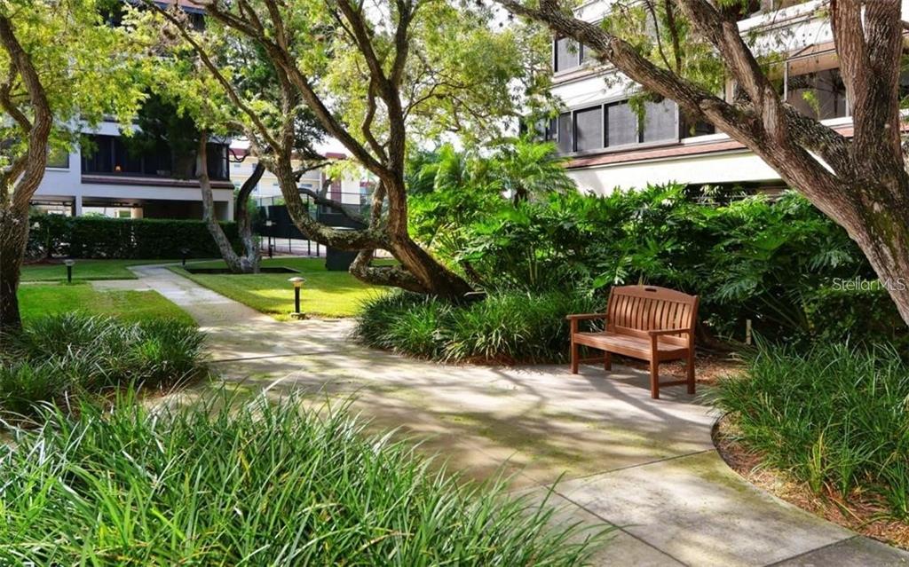 6285 Midnight Pass Road, Unit 403 Sarasota, FL 34242 - Photo 29 of 51 a view of a swimming pool with a patio