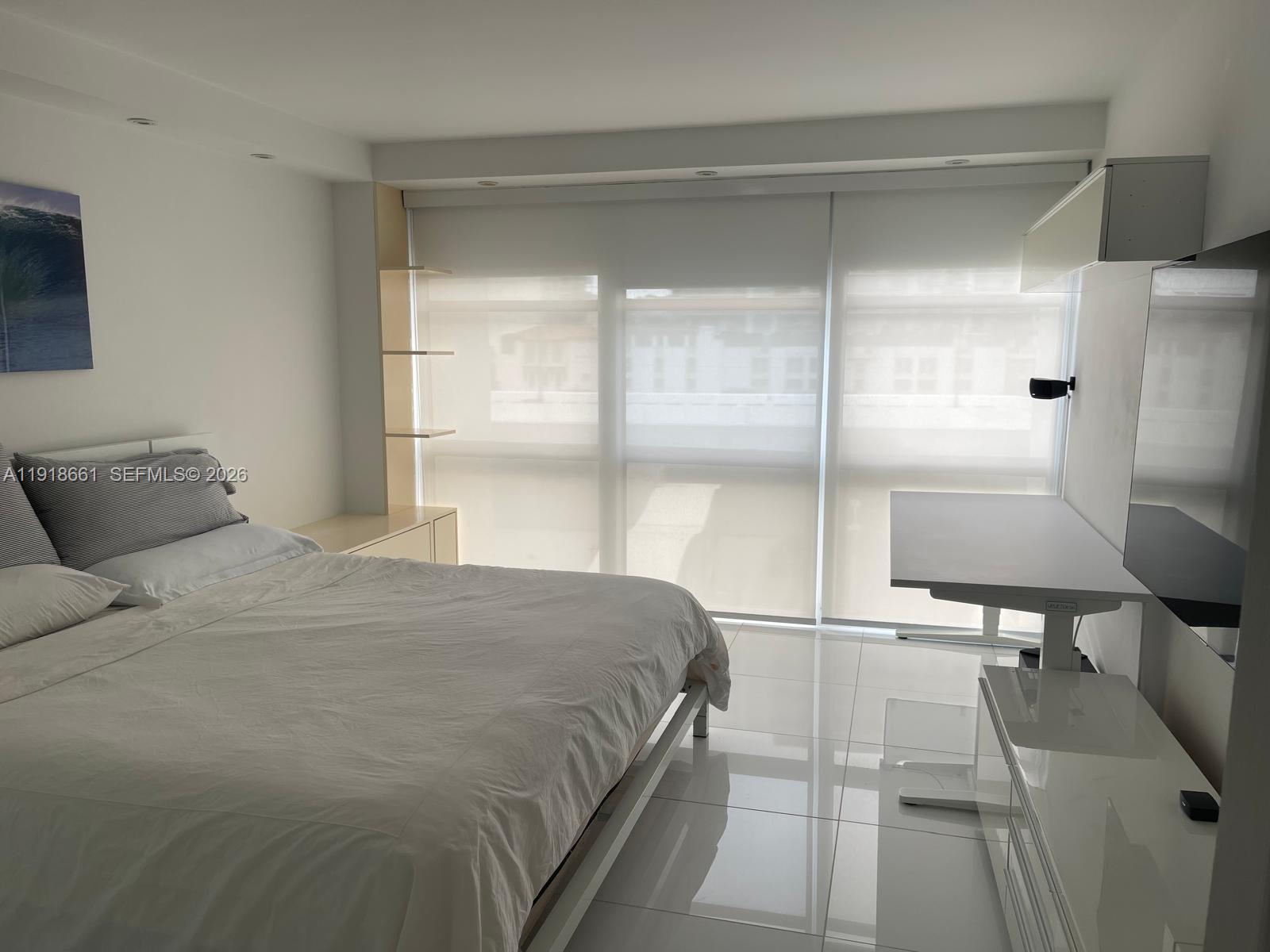 16909 North Bay Road, Unit 716 Sunny Isles Beach, FL 33160 - Photo 13 of 26 a bedroom with a bed and with furniture