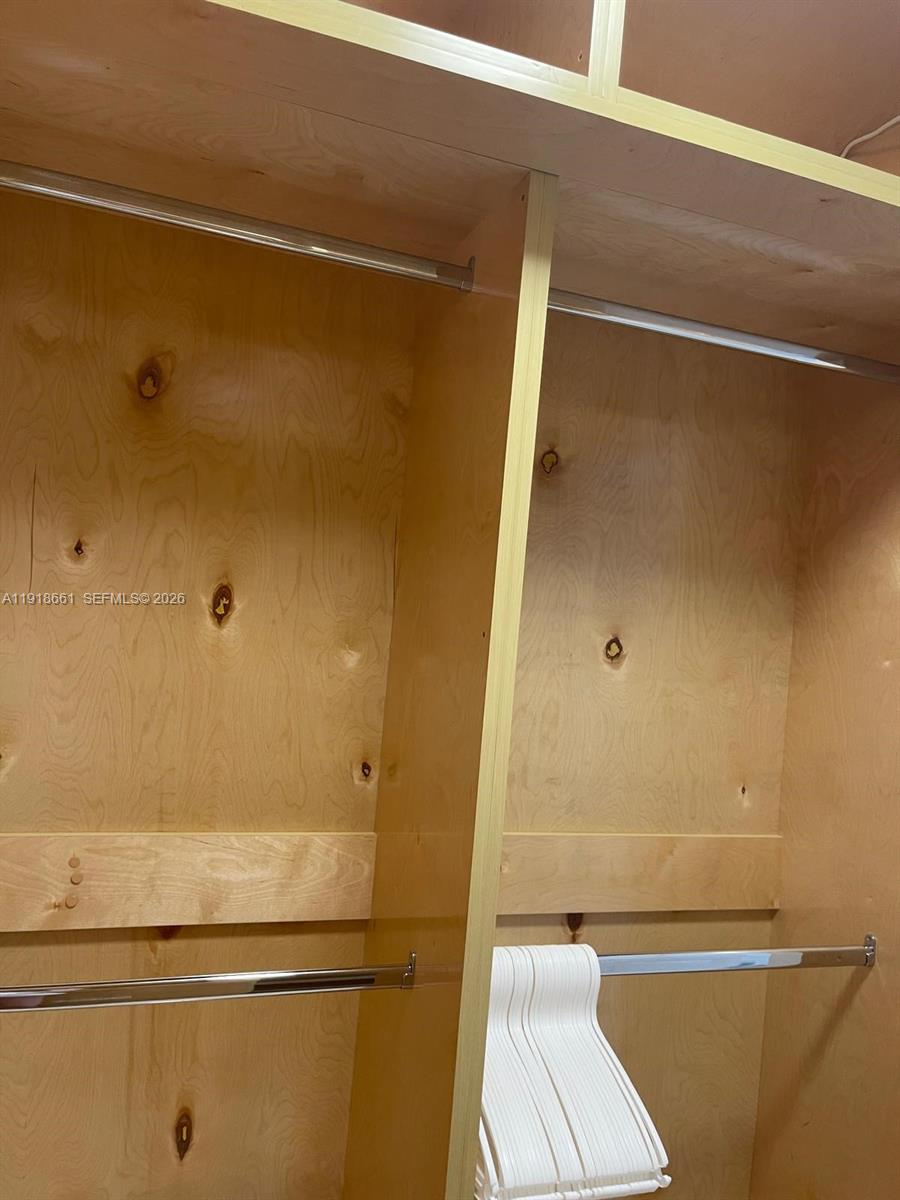 16909 North Bay Road, Unit 716 Sunny Isles Beach, FL 33160 - Photo 16 of 26 a bathroom with a shower and a toilet