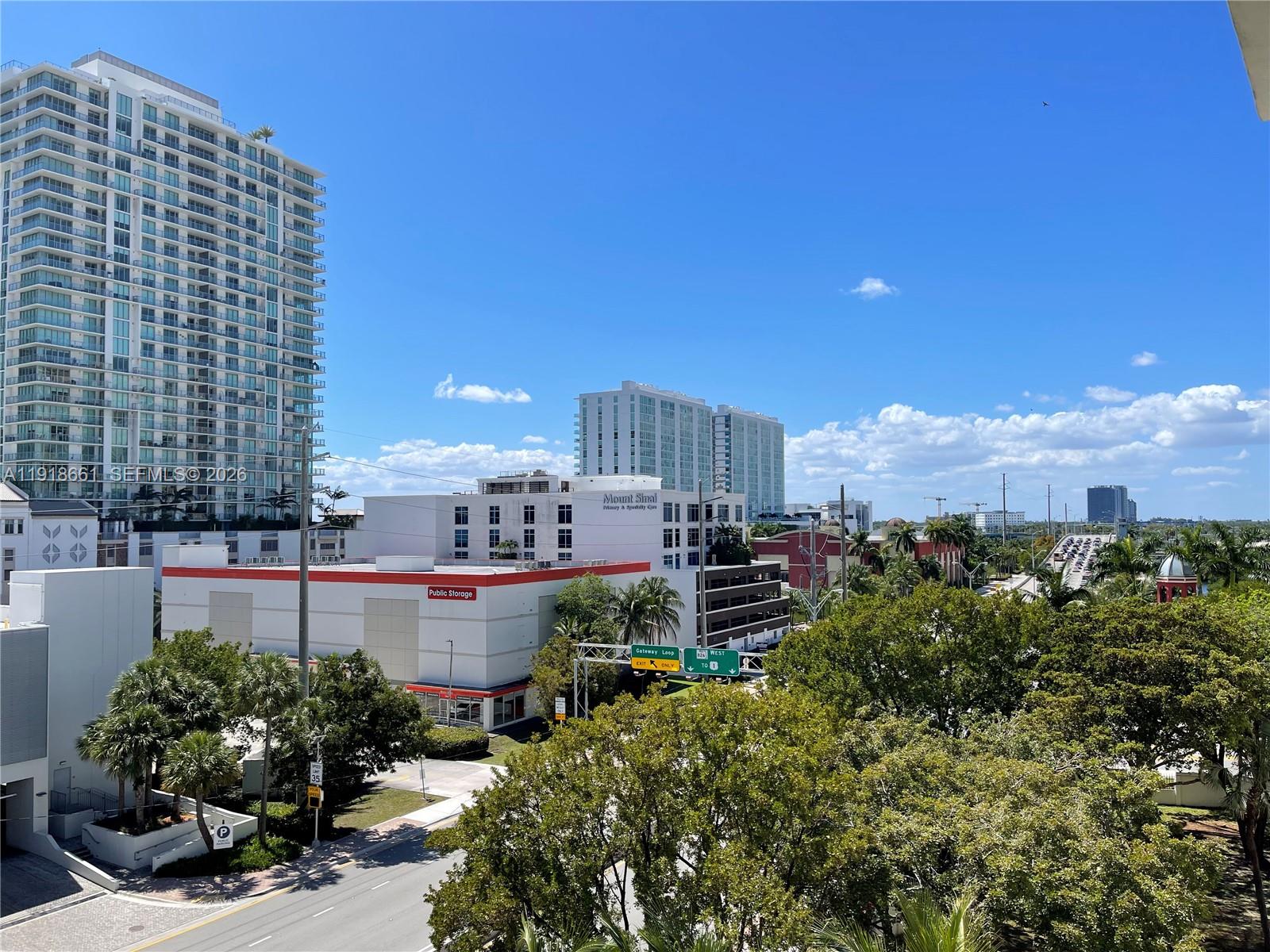 16909 North Bay Road, Unit 716 Sunny Isles Beach, FL 33160 - Photo 2 of 26 a view of a chairs and table in a backyard