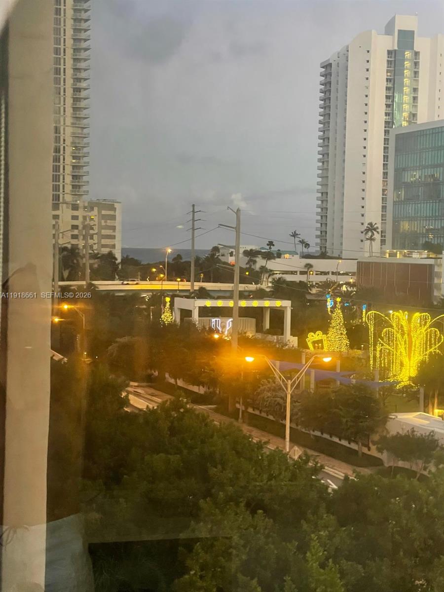 16909 North Bay Road, Unit 716 Sunny Isles Beach, FL 33160 - Photo 3 of 26 a view of a swimming pool with chairs