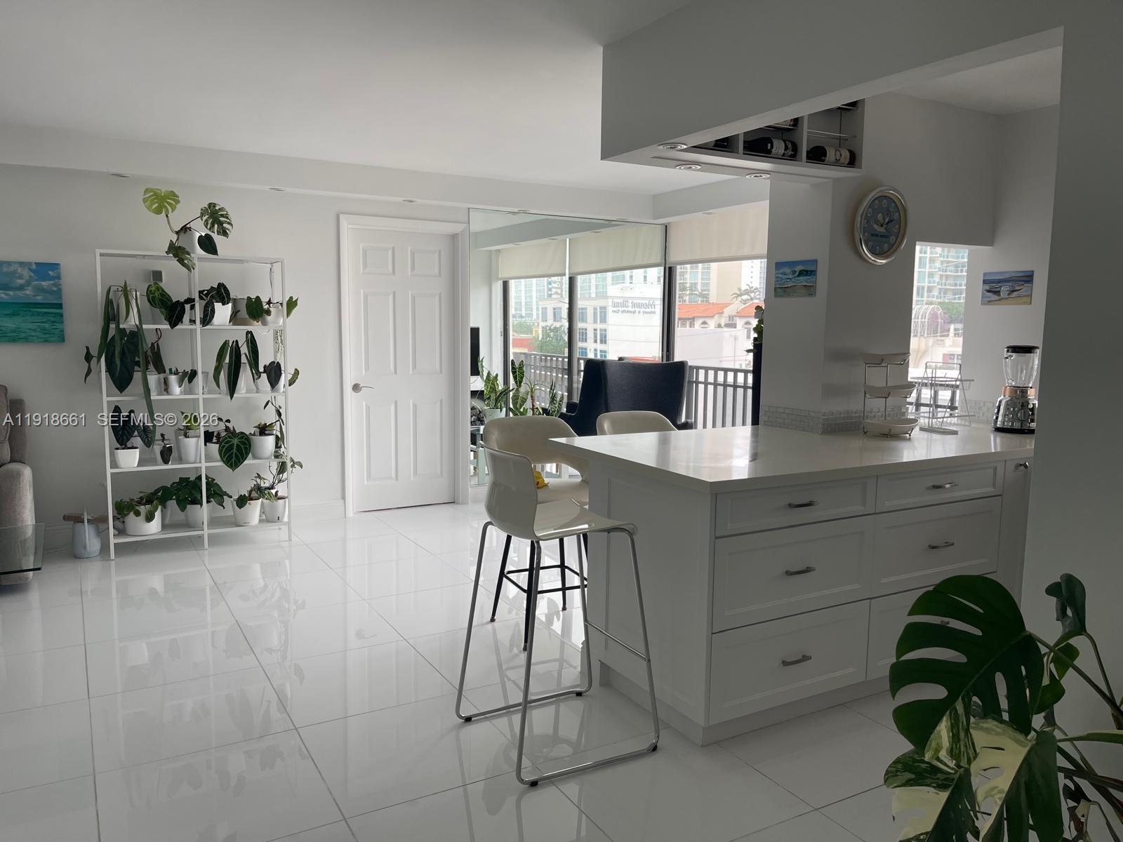 16909 North Bay Road, Unit 716 Sunny Isles Beach, FL 33160 - Photo 6 of 26 a very nice looking room with a chair