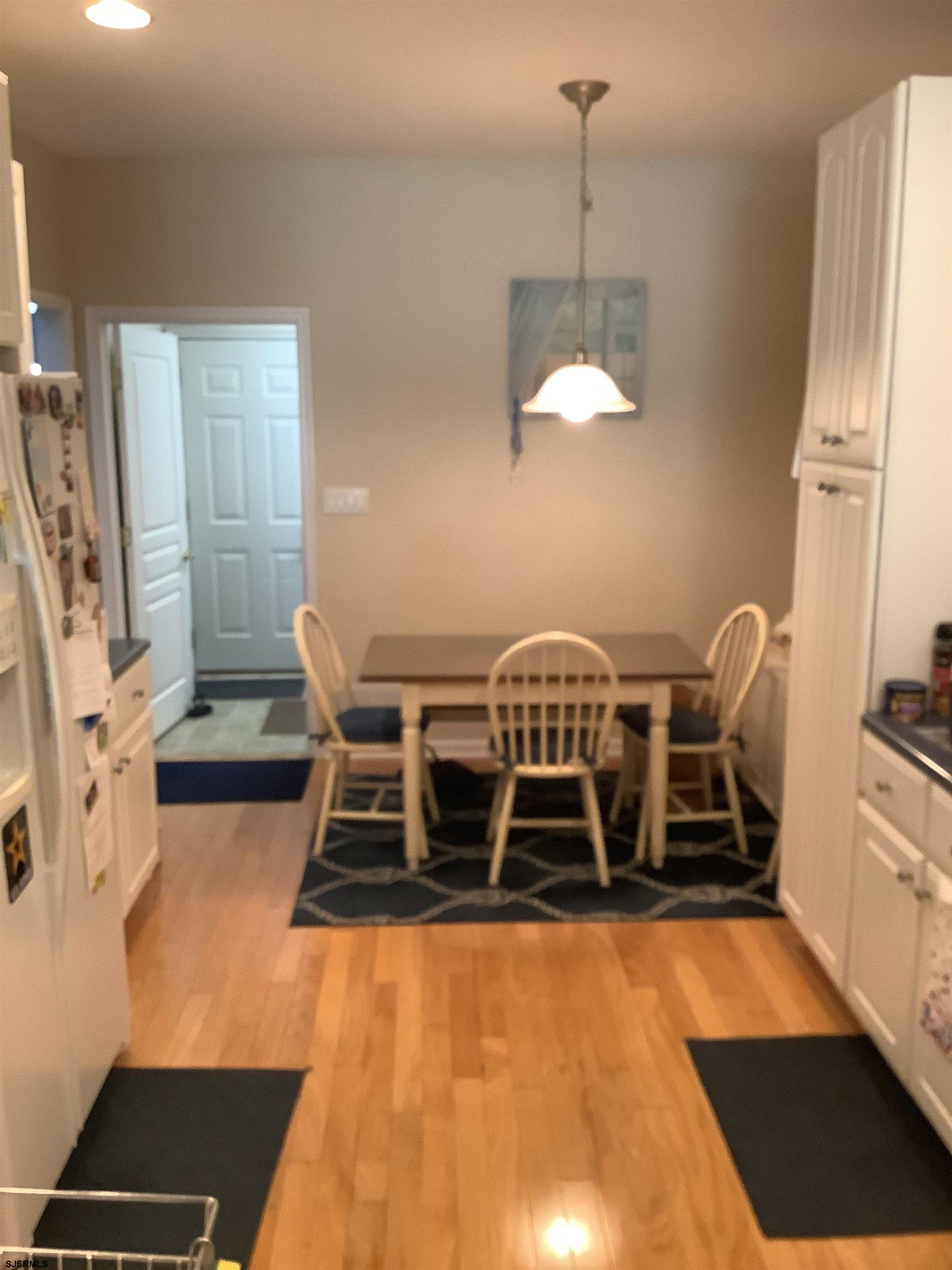1731 South Shore Road, Unit 128 Marmora, NJ 08230 - Photo 4 of 13 a living room with a furniture fireplace and rug