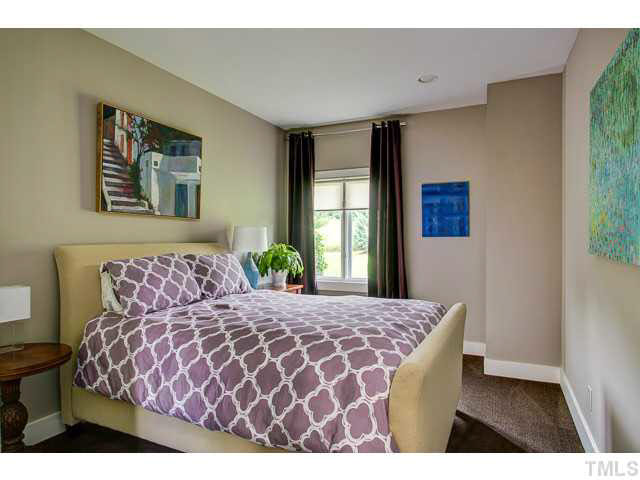 6705 Green Rise Road Hillsborough, NC 27278 - Photo 14 of 24 a bedroom with a large bed and a painting on the wall