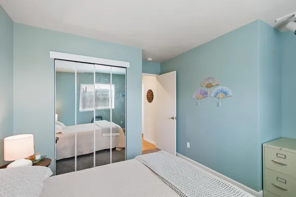 a bedroom with furniture and a window