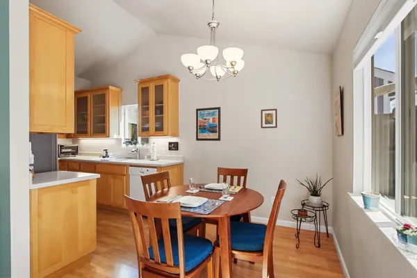 a view of a dining room with furniture and wooden floor