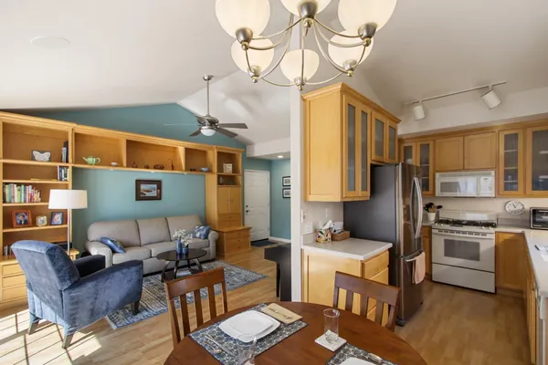 a bedroom with furniture and a wooden floor