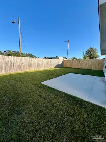 a view of a field with a big yard