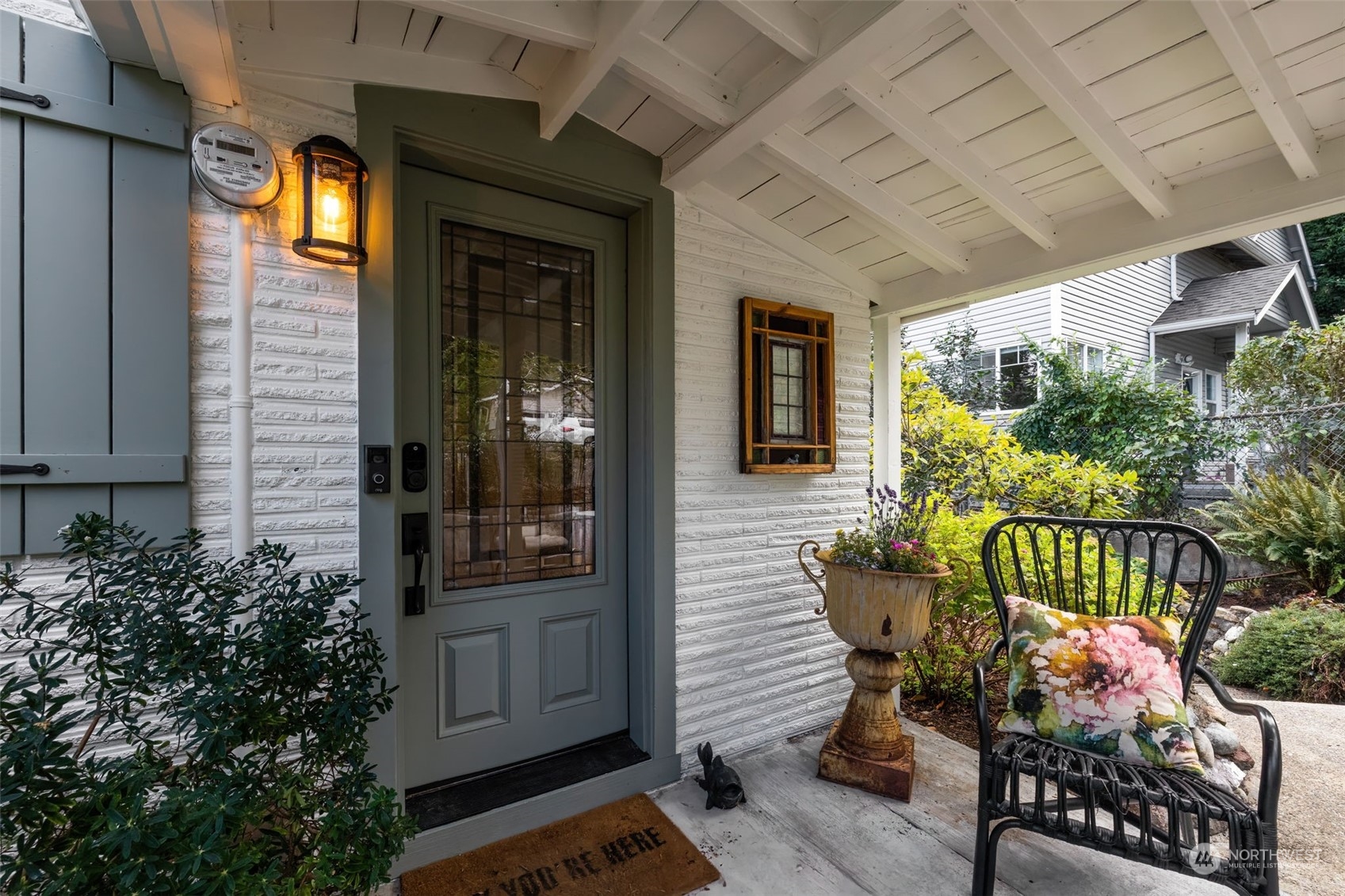 2016 Madrona Point Bremerton, WA 98312 - Photo 11 of 36 a front view of a house with outdoor seating and plants