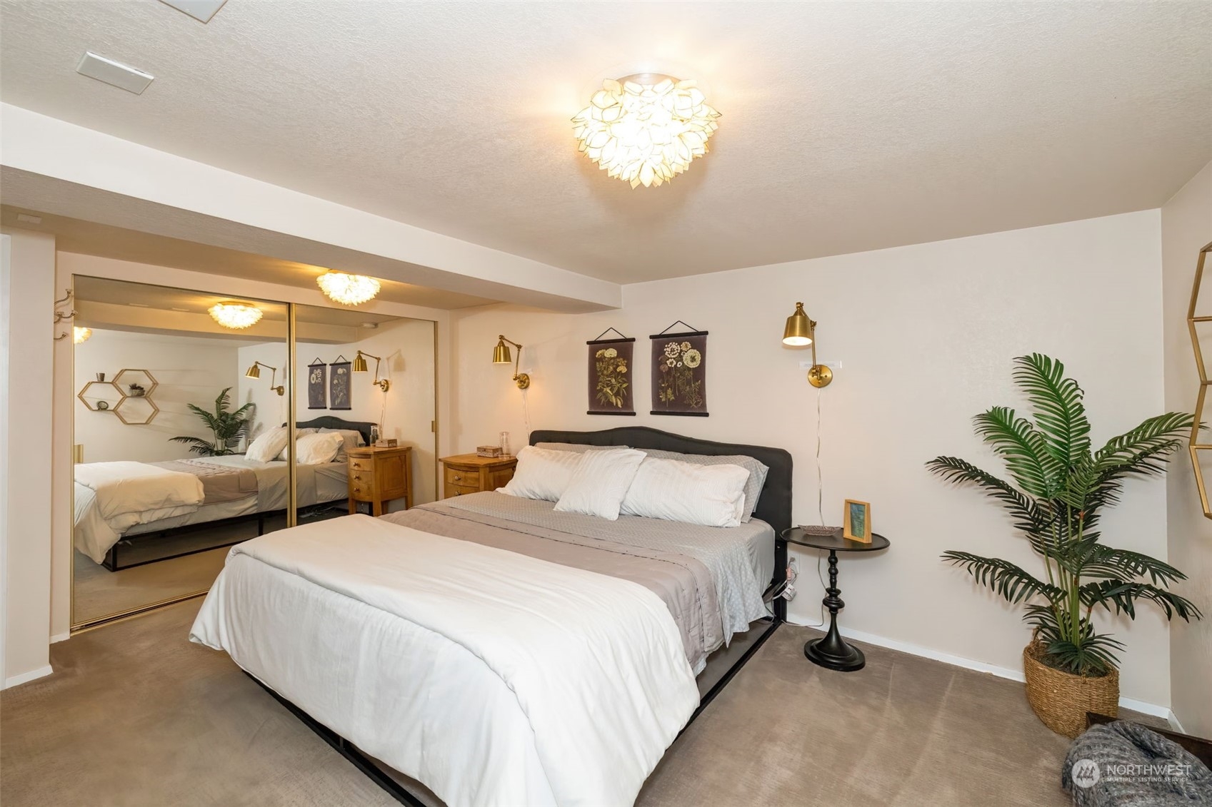 2016 Madrona Point Bremerton, WA 98312 - Photo 26 of 36 a bedroom with bed and a chandelier