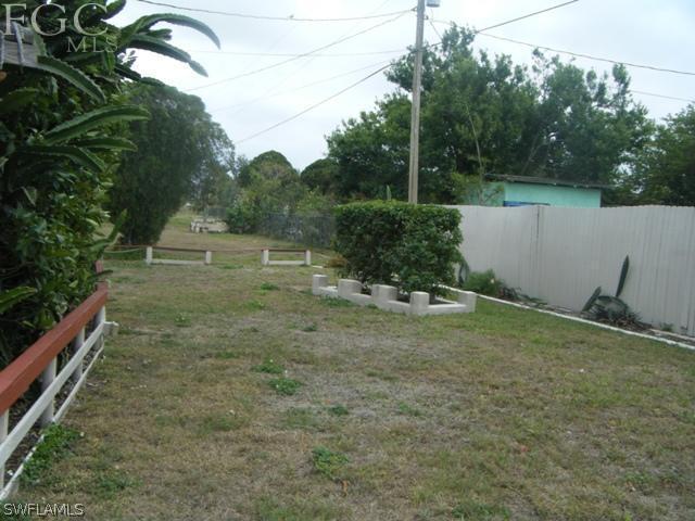 500 Oregon Road West Lehigh Acres, FL 33936 - Photo 20 of 24 a view of a backyard