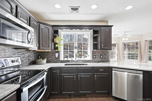 a kitchen with a sink and a stove