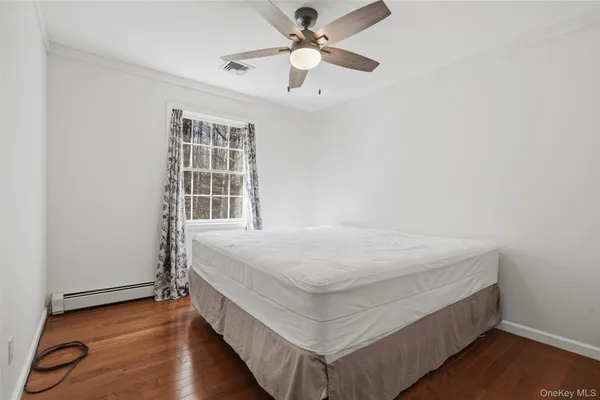 a room with a bed and a window