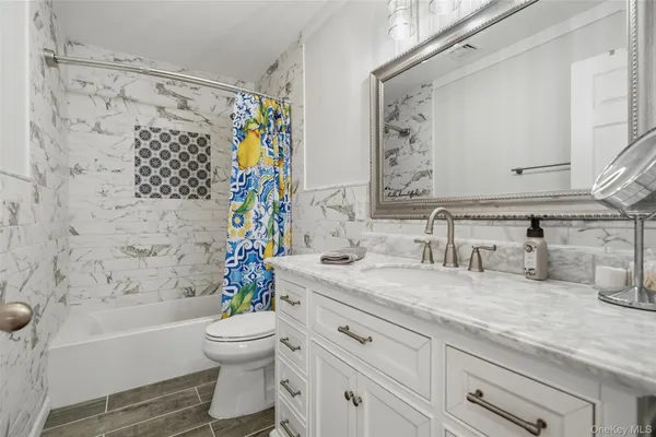 a bathroom with a sink a toilet and a bathtub