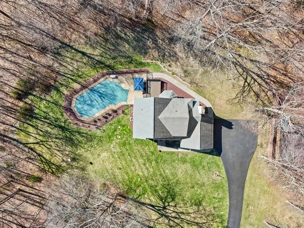 a house view with a trees in front of it