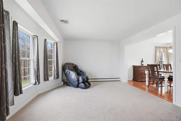 a view of workspace with furniture and window