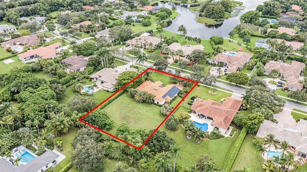 10345 Southwest 23rd Court Davie, FL 33324 - Photo 1 of 4 an aerial view of a house with a yard and lake