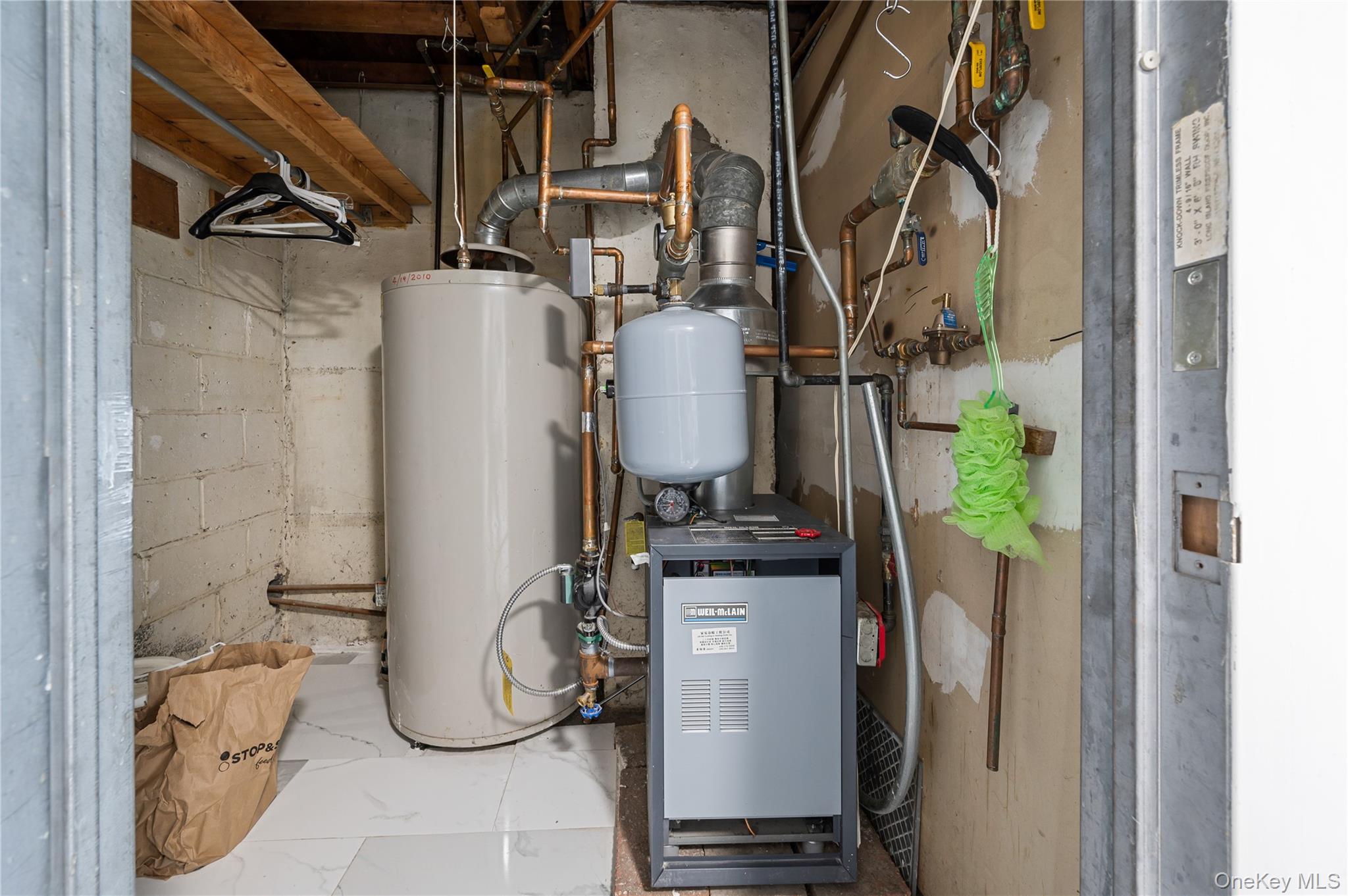 152-10 Peck Avenue Queens, NY 11355 - Photo 21 of 26 Utilities with water heater and a heating unit