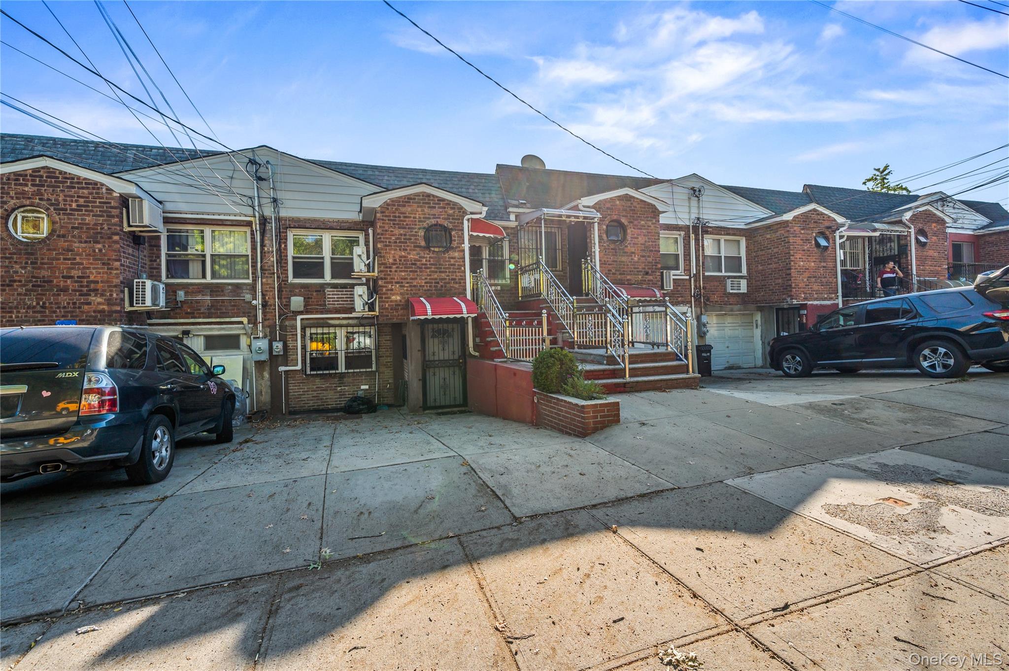 152-10 Peck Avenue Queens, NY 11355 - Photo 22 of 26 View of front of home with brick siding and a residential view