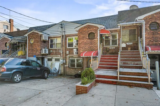 a view of a car park in front of house