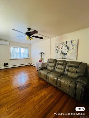 a living room with couch and a window