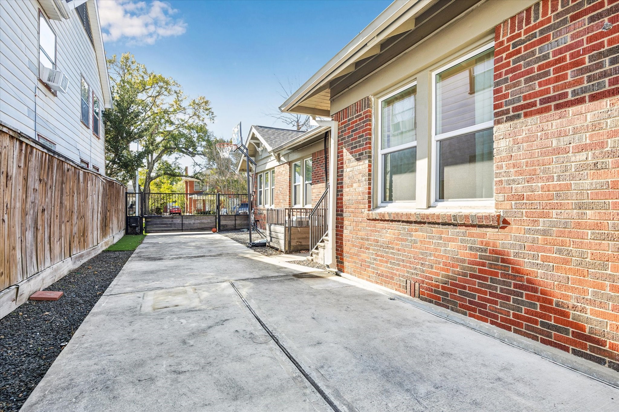 1624 Branard Street Houston, TX 77006 - Photo 23 of 25 a view of a brick house with many windows