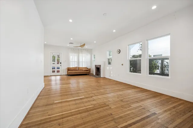 a view of kitchen and hall with wooden floor
