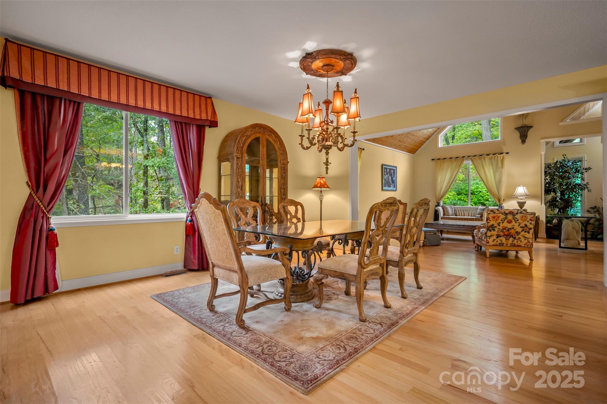 768 White Oak Lane Tryon, NC 28782 - Photo 14 of 48 a view of a dining room with furniture window and wooden floor
