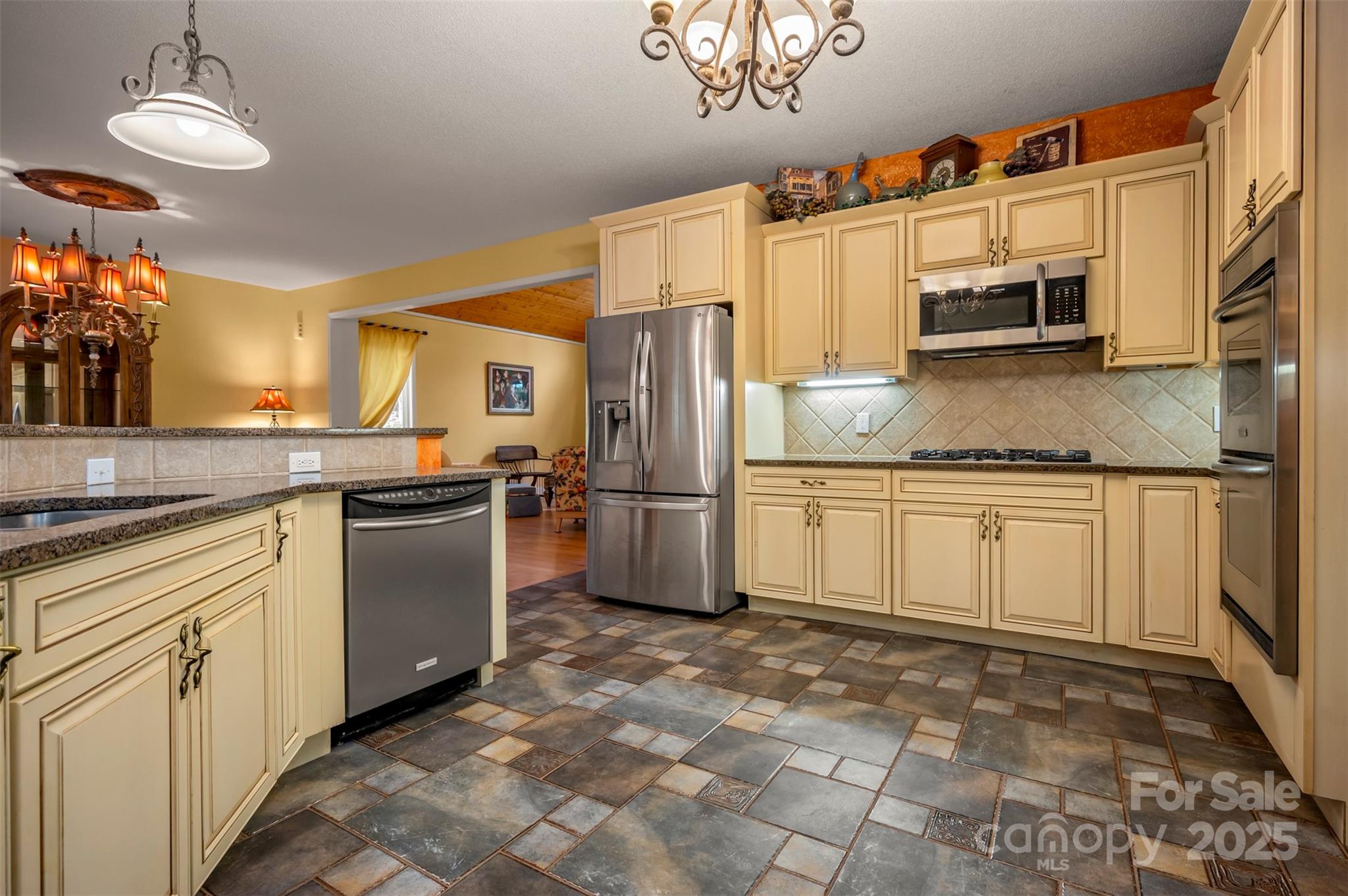 768 White Oak Lane Tryon, NC 28782 - Photo 15 of 48 a kitchen with granite countertop cabinets and stainless steel appliances