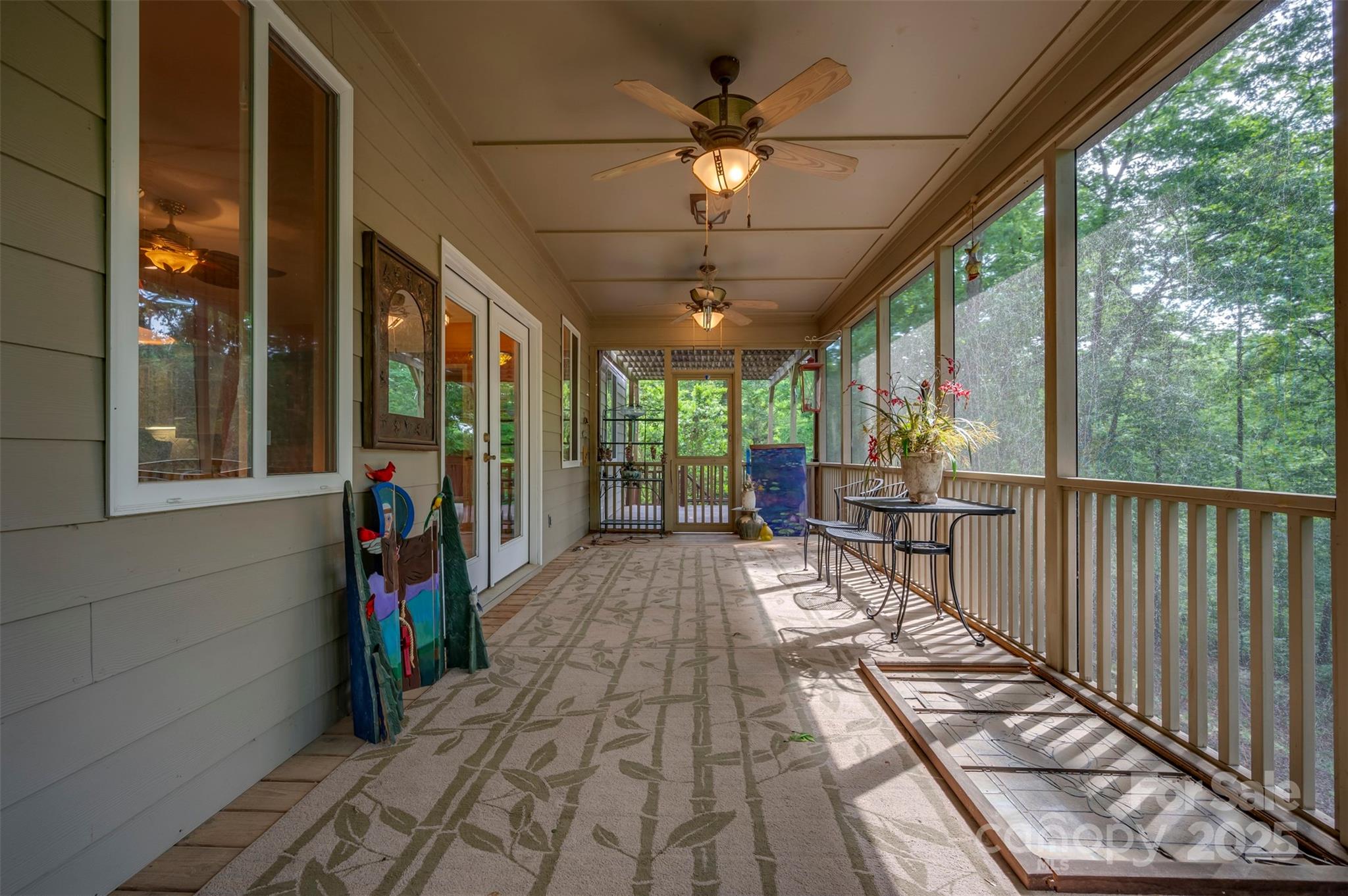 768 White Oak Lane Tryon, NC 28782 - Photo 35 of 48 a view of a porch with wooden floor and furniture