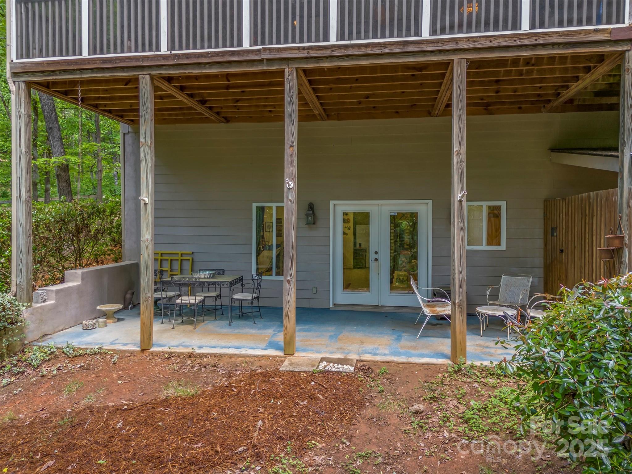 768 White Oak Lane Tryon, NC 28782 - Photo 37 of 48 a backyard of a house with outdoor seating