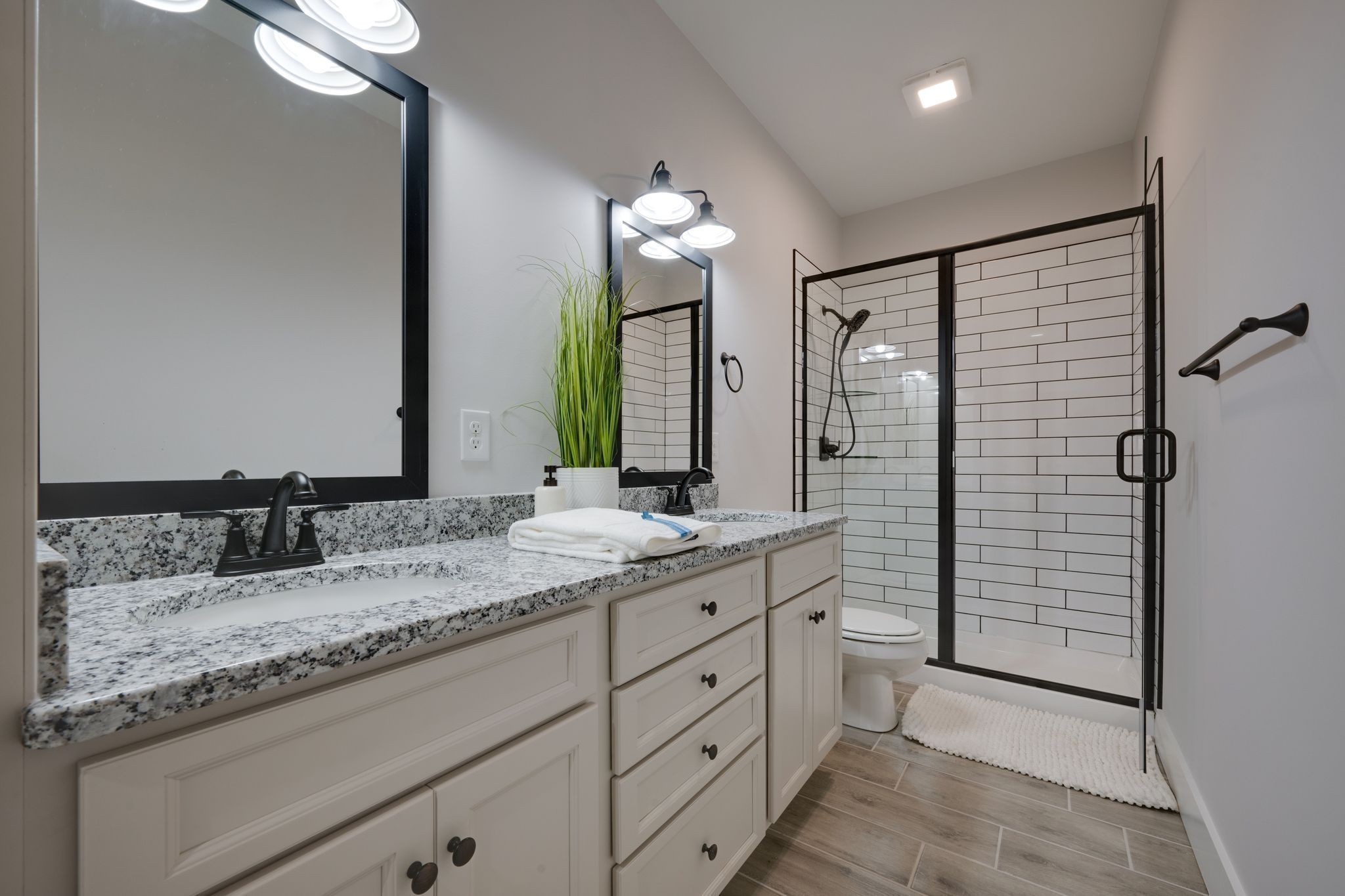 2 Hickory Hills Drive Dickson, TN 37055 - Photo 18 of 34 a bathroom with a granite countertop sink and a mirror