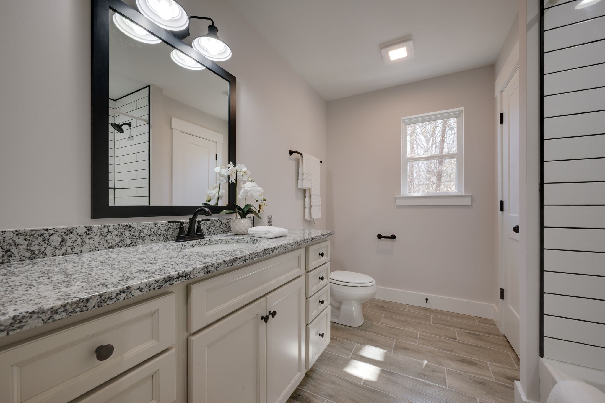 2 Hickory Hills Drive Dickson, TN 37055 - Photo 25 of 34 a bathroom with a granite countertop sink a toilet and a mirror