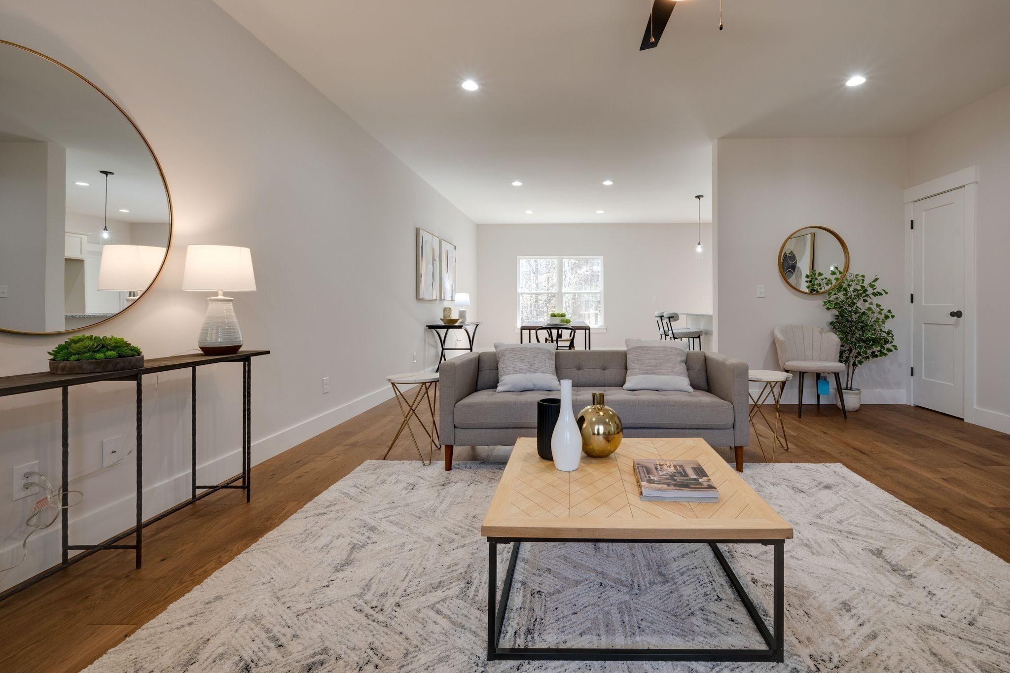 2 Hickory Hills Drive Dickson, TN 37055 - Photo 4 of 34 a living room with furniture a wooden floor and a large mirror