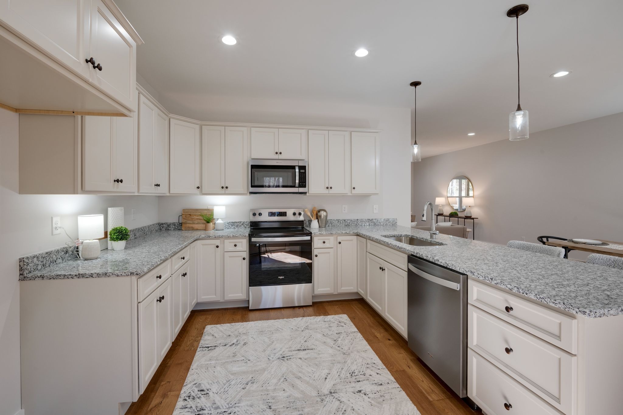 2 Hickory Hills Drive Dickson, TN 37055 - Photo 7 of 34 a kitchen with granite countertop a sink and white cabinets