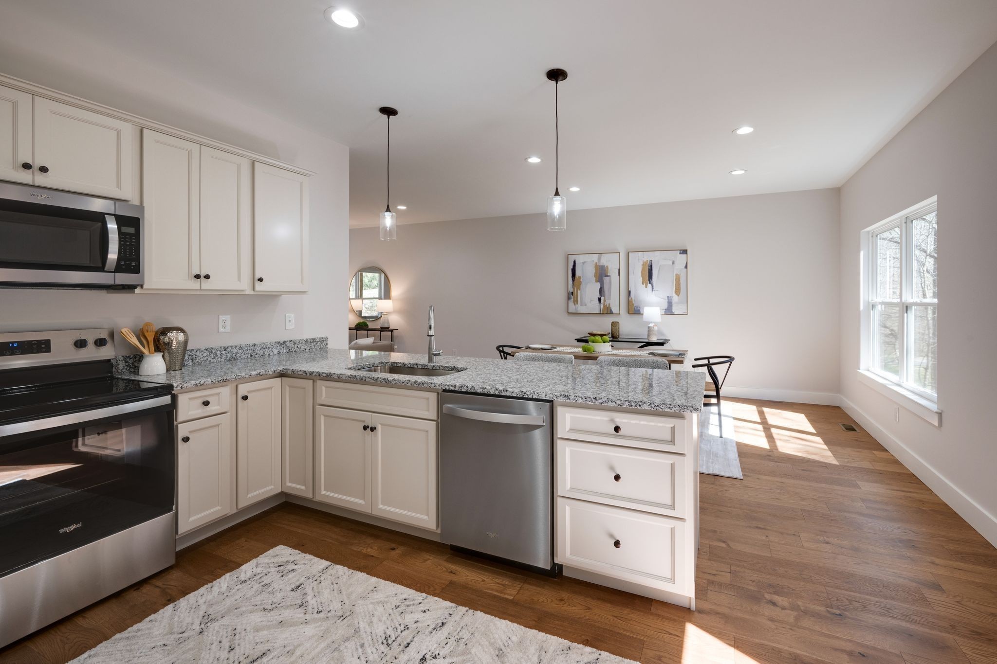 2 Hickory Hills Drive Dickson, TN 37055 - Photo 8 of 34 a kitchen with granite countertop white cabinets and white appliances