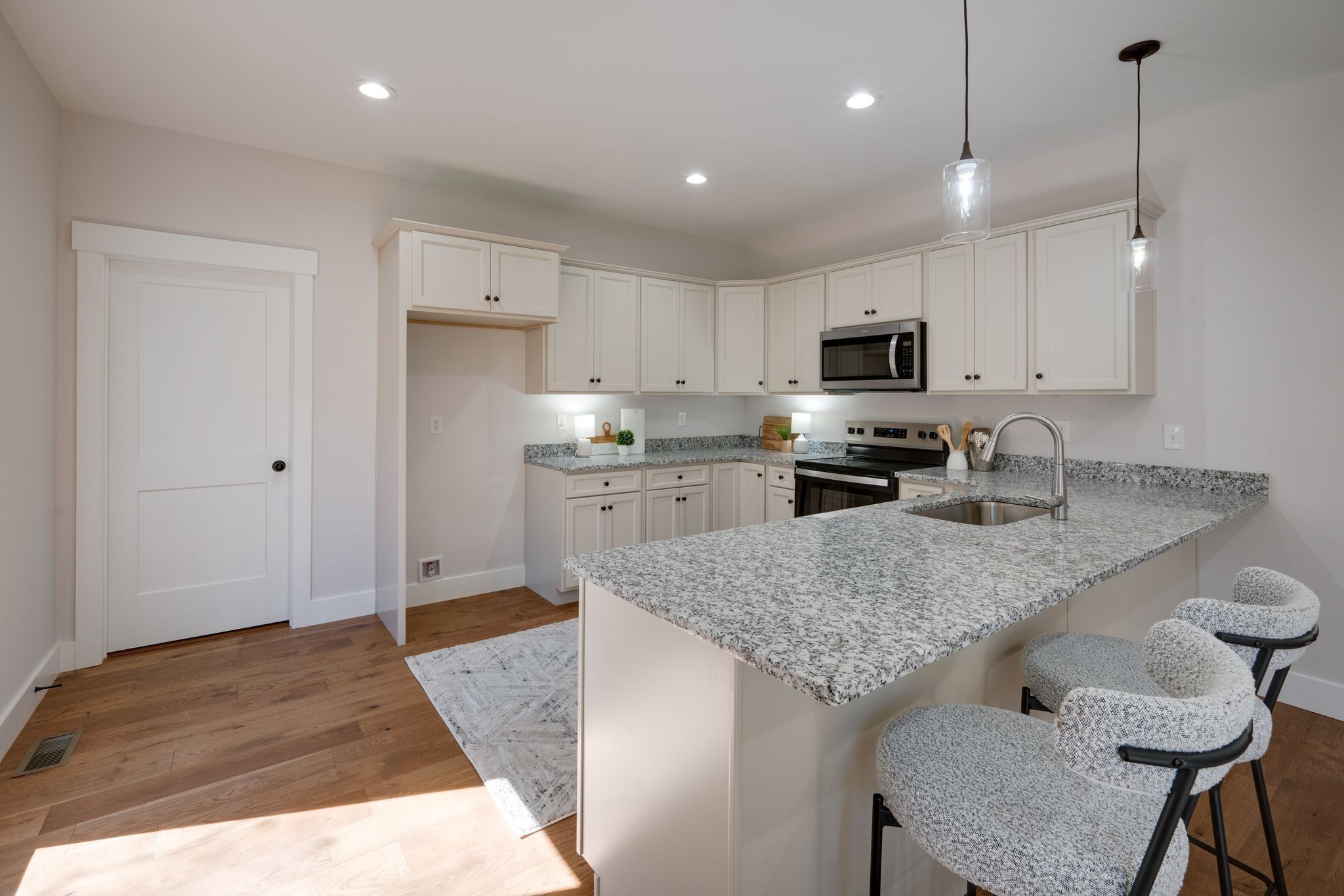 2 Hickory Hills Drive Dickson, TN 37055 - Photo 9 of 34 a kitchen with stainless steel appliances granite countertop a sink refrigerator and cabinets