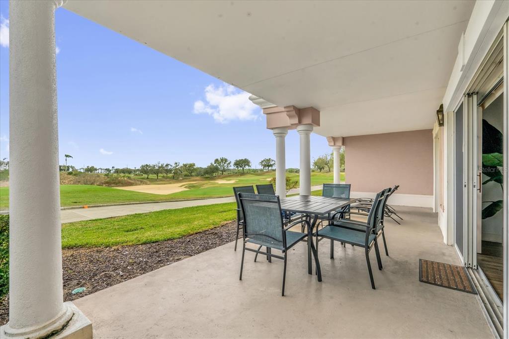 1362 Centre Ct Ridge Drive, Unit 102 Reunion, FL 34747 - Photo 2 of 35 a view of a dining room with furniture window and outside view