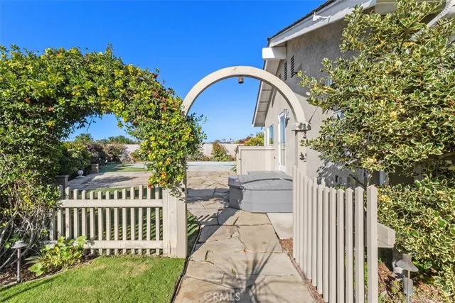 a view of a house with swimming pool and a yard